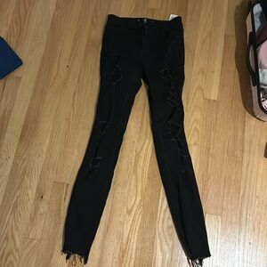 Tight black ripped jeans